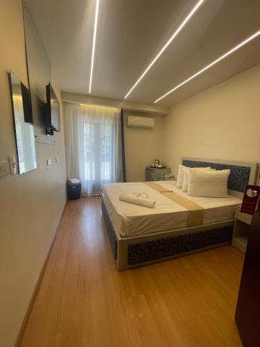 a bedroom with a large bed in a room at Ambiance Downtown Cairo Hotel in Cairo
