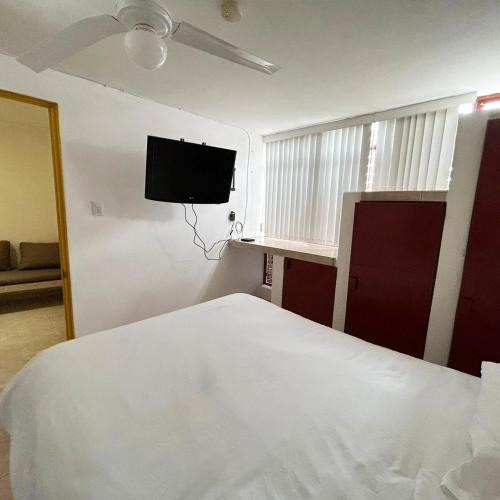 Katil atau katil-katil dalam bilik di INMOTEGA - Suites TG