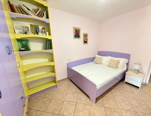 Postel nebo postele na pokoji v ubytování Anesti Apartment