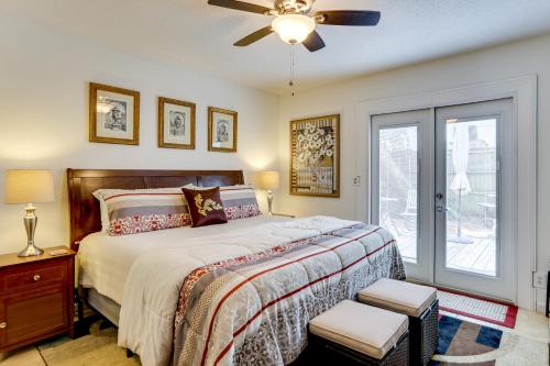 a bedroom with a bed and a ceiling fan at Centrally Located St Simons Island Getaway! in Ebo Landing
