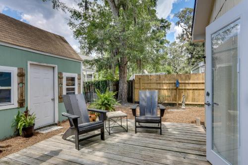a patio with two chairs and a table on a deck at Centrally Located St Simons Island Getaway! in Ebo Landing
