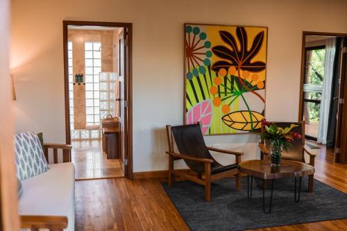 a living room with a couch and a table at TreeCasa Hotel & Resort Nicaragua in San Juan del Sur