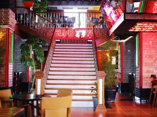 a set of stairs leading up to a restaurant at Tha Nickolee Hotel in Nanyuki