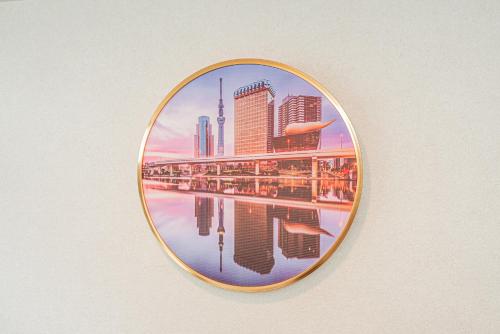 a picture of a city in a circle on a wall at Private 3 Bedroom House with Free Parking Near Asakusa and Skytree in Tokyo