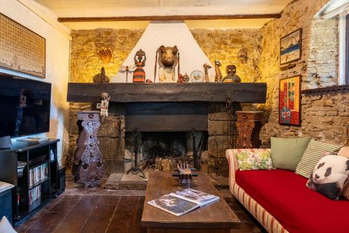 a living room with a couch and a fireplace at Il Rancho Grande in Città di Castello