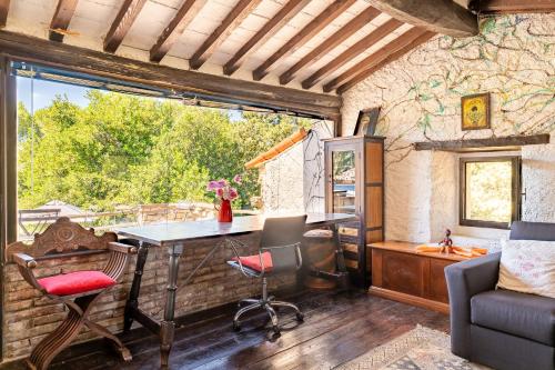 a room with a table and chairs and a window at Il Rancho Grande in Città di Castello