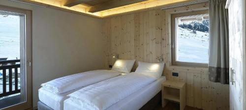 Letto o letti in una camera di Livigno Wooden House
