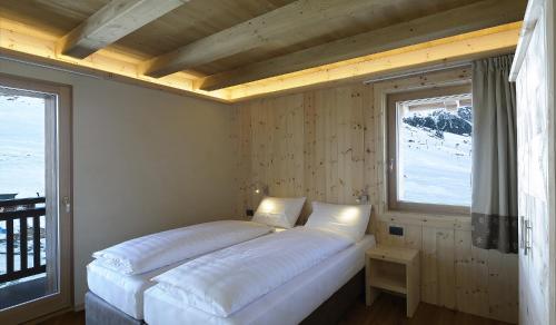 Letto o letti in una camera di Livigno Wooden House