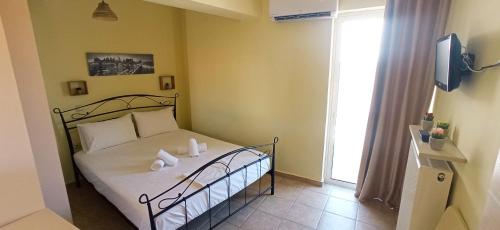 Postel nebo postele na pokoji v ubytování Katerina sitia apartments 1