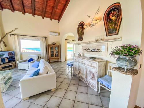 a living room with a couch and a table at Apartment Ginestra by Interhome in Casa Tamponi
