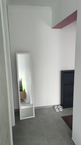 a room with a mirror and a tiled floor at Lion in Višegrad