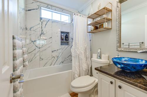 a bathroom with a blue sink and a shower at Bluffton Getaway with Fenced Yard 7 Mi to Beach! in Bluffton