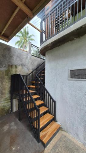 a staircase in a building with wooden steps at MyHome - Lombok in Tetebatu