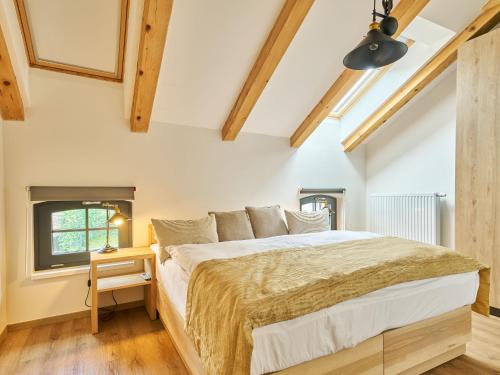 Katil atau katil-katil dalam bilik di Apartment Luxury Mountain Attic by Interhome