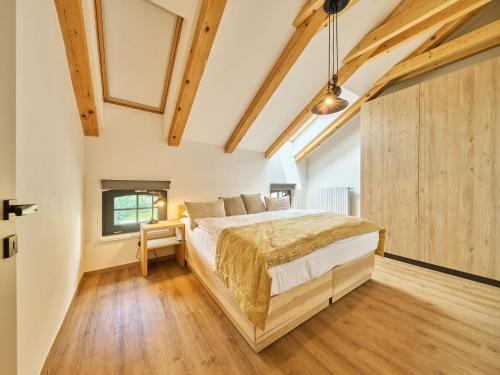 Katil atau katil-katil dalam bilik di Apartment Luxury Mountain Attic by Interhome