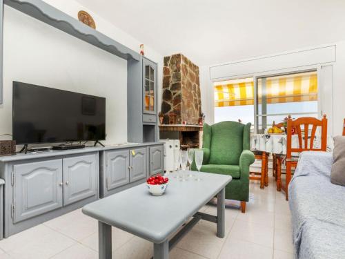 a living room with a couch and a tv at Apartment Bahia by Interhome in Cunit