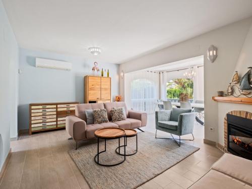a living room with a couch and two chairs at Holiday Home Los Limoneros de Moraira by Interhome in Moraira