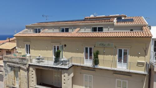 a large building with balconies on top of it at Adesi 15 Tropea - Suites de Charme in Tropea