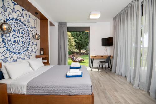a bedroom with a bed with a blue and white wall at BlueSkyline Owner's Listing, By Hellocrete in Chania Town