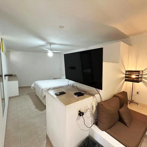 Katil atau katil-katil dalam bilik di INMOTEGA - Suites TG