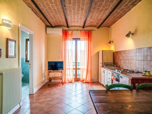 a kitchen with a large window and a table at Apartment Bomba vista lago 7 by Interhome in Villa Santa Maria
