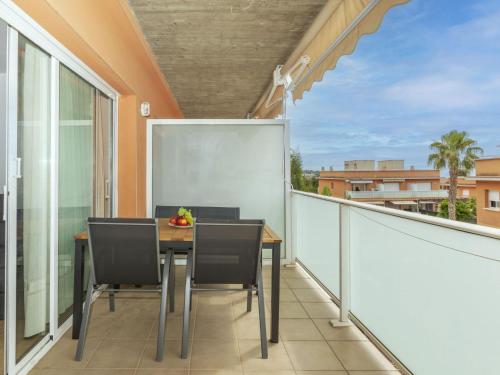 a balcony with a table and chairs on a balcony at Apartment Ronda Creixell by Interhome in Creixell