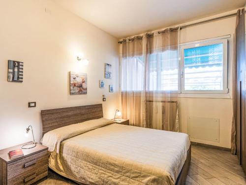 Apartment La dimora del pontile by Interhomeにあるベッド