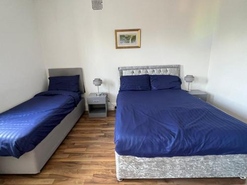 Ένα ή περισσότερα κρεβάτια σε δωμάτιο στο The Noisy Rooms
