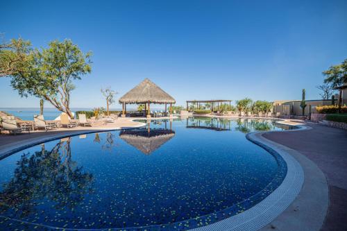 a swimming pool at a resort with a gazebo at Luxurious Penthouse at Vistamar! Golf - Beachclub in La Paz