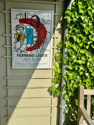 a sign hanging on the side of a house at Beach House In Ålsgårde in Ålsgårde