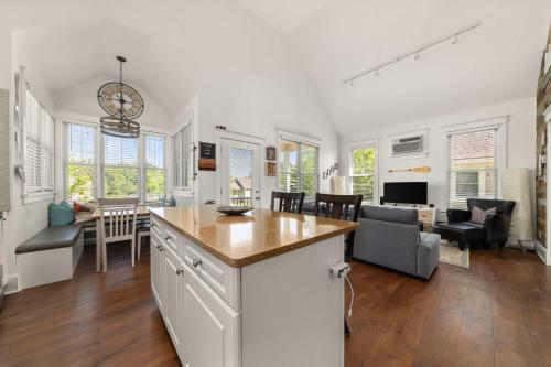a kitchen and living room with a table and chairs at The Sparrow - 32 Meadow View in Cherry Valley