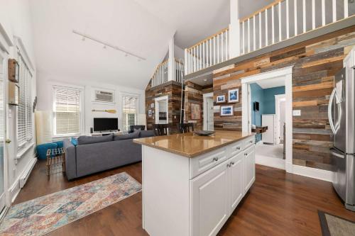 a kitchen and living room with a couch and a table at The Sparrow - 32 Meadow View in Cherry Valley