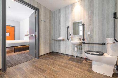 a bathroom with a toilet and a sink at easyHotel Belfast in Belfast