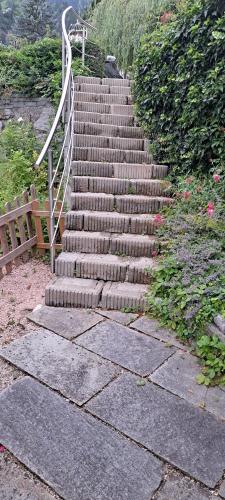a set of stairs with a hand railing on it at Fewo Hereinspaziert in Schwendau
