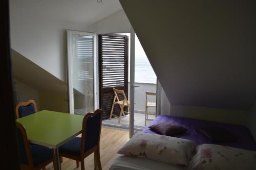 Postel nebo postele na pokoji v ubytování Apartments Jana