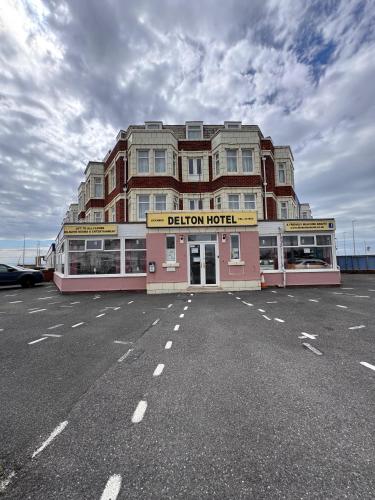 a building on the side of a parking lot at RideSide Hotel in Blackpool
