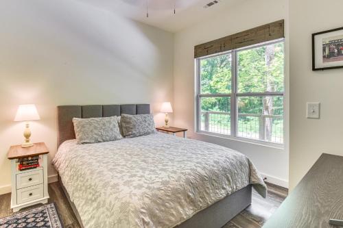 a bedroom with a bed and a window at Pool and Golf Access Family Cabin in Clayton in Clayton