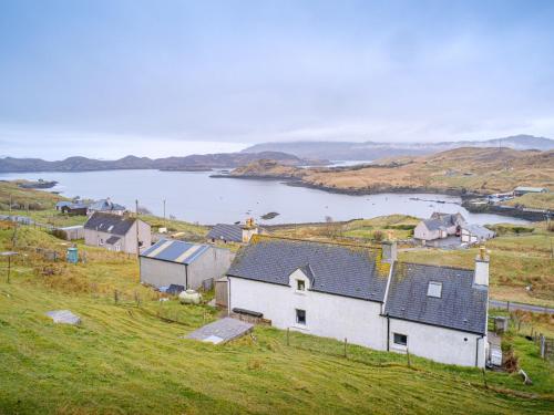 a small village on a hill with a body of water at The Nicolson House in Graver