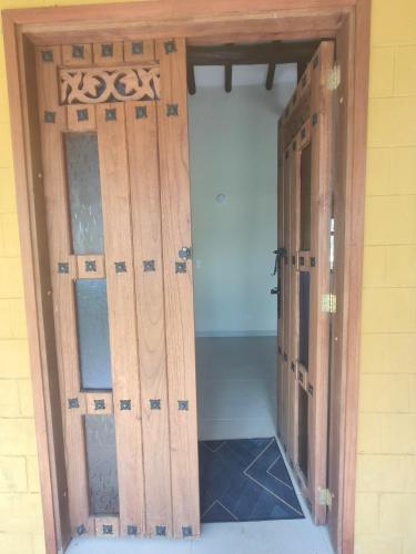 an open door in a room with a room with a door at Cabaña Santa Alicia in Villa de Leyva