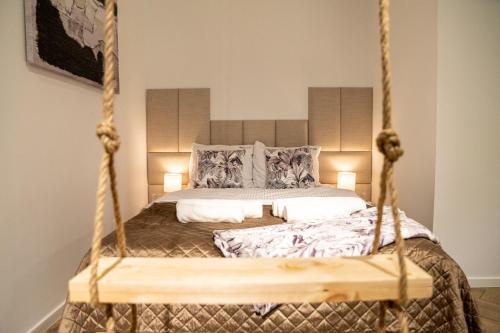 a bedroom with a bed with a swing at Hop & Lulu Park Studio in Gollnow