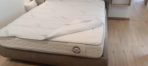 two mattresses stacked on top of each other on a bed at Little House Leonardo Airport in Azzano San Paolo