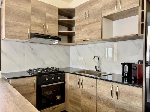 Aria Faqra 3BR w Balconyにあるキッチンまたは簡易キッチン