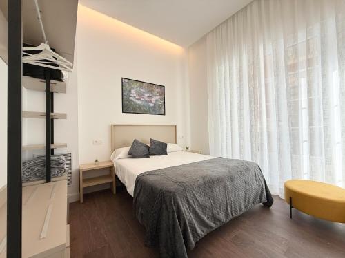 Apartamentos Mk77 León Zuloagaにあるベッド