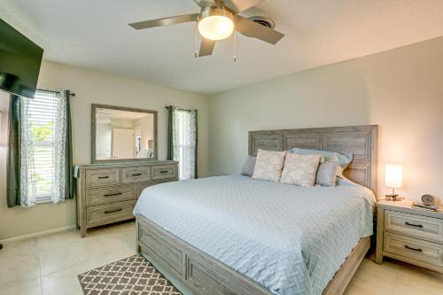 a bedroom with a bed and a ceiling fan at Casa Mar Van Beautiful Property with Heated Pool and Spa minutes to beaches and golf in Rotonda West