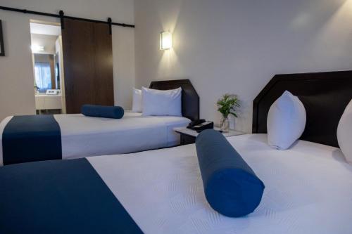 Ένα ή περισσότερα κρεβάτια σε δωμάτιο στο Hotel Del Rio
