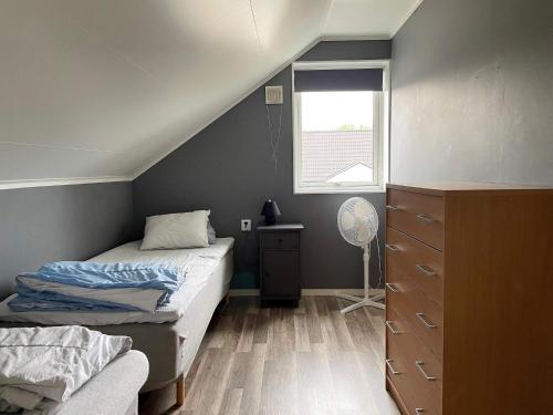 a small bedroom with two beds and a window at 4 star holiday home in Gotlands Tofta in Tofta