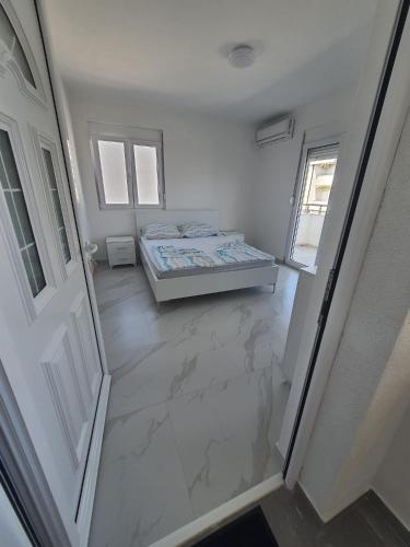 Postel nebo postele na pokoji v ubytování Apartmani Ajla
