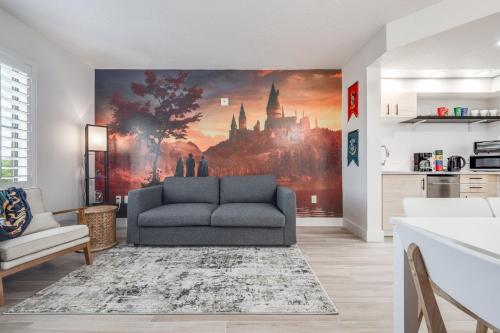 a living room with a couch and a wall mural at Harry Potter Suite near Epic & Universal in Orlando