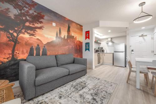 a living room with a couch and a kitchen at Harry Potter Suite near Epic & Universal in Orlando