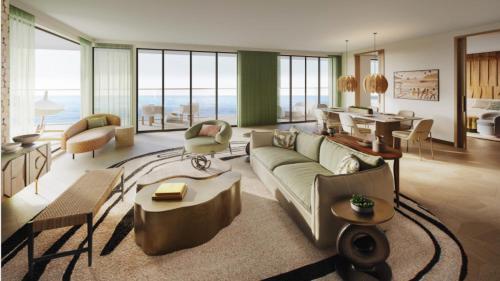 a living room with a couch and a table at Hotel Indigo Bridgetown Barbados by IHG in Bridgetown